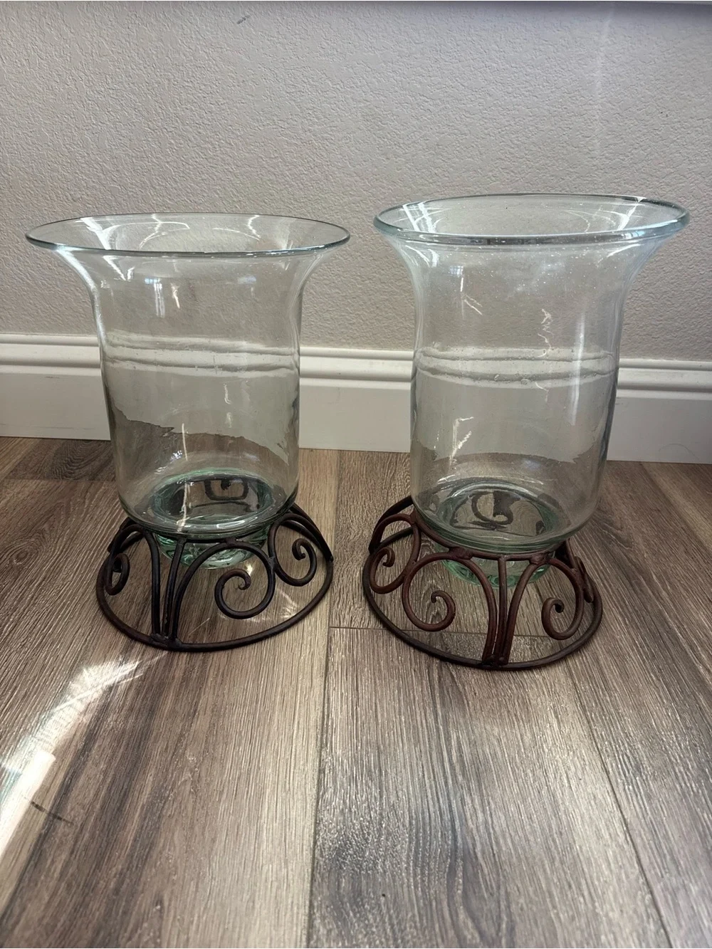 Clear Glass Hurricane Vases with Brown Scrolled Metal Bases, Set of 2